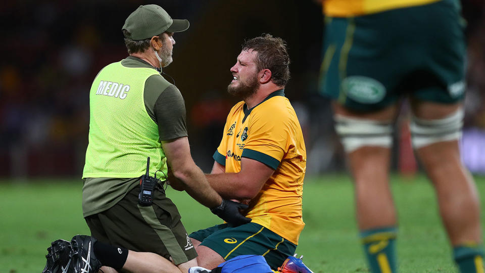 James Slipper is seen here being attended to after suffering a wrist injury.