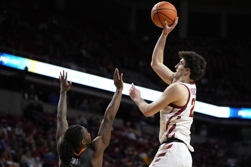 Iowa State forward Milan Momcilovic shoots over Oklahoma State guard Javon Small, left, during the second half of an NCAA college basketball game, Saturday, Jan. 13, 2024, in Ames, Iowa. Iowa State won 66-42. (AP Photo/Charlie Neibergall)