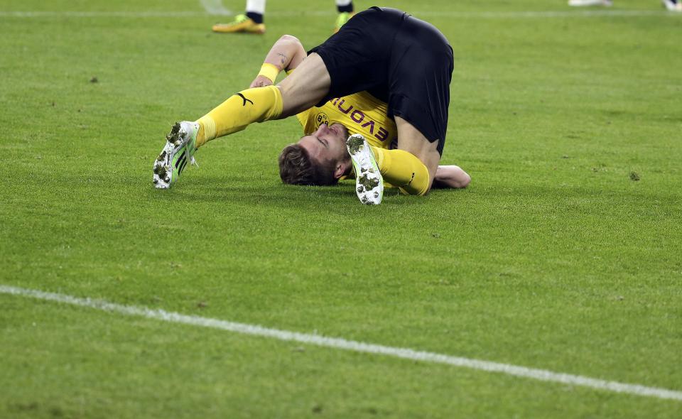 Borussia Dortmund's Ciro Immobile falls onto the pitch during their Champions League round of 16 first leg soccer match against Juventus at the Juventus stadium in Turin February 24, 2015. REUTERS/Alessandro Bianchi (ITALY - Tags: SPORT SOCCER)