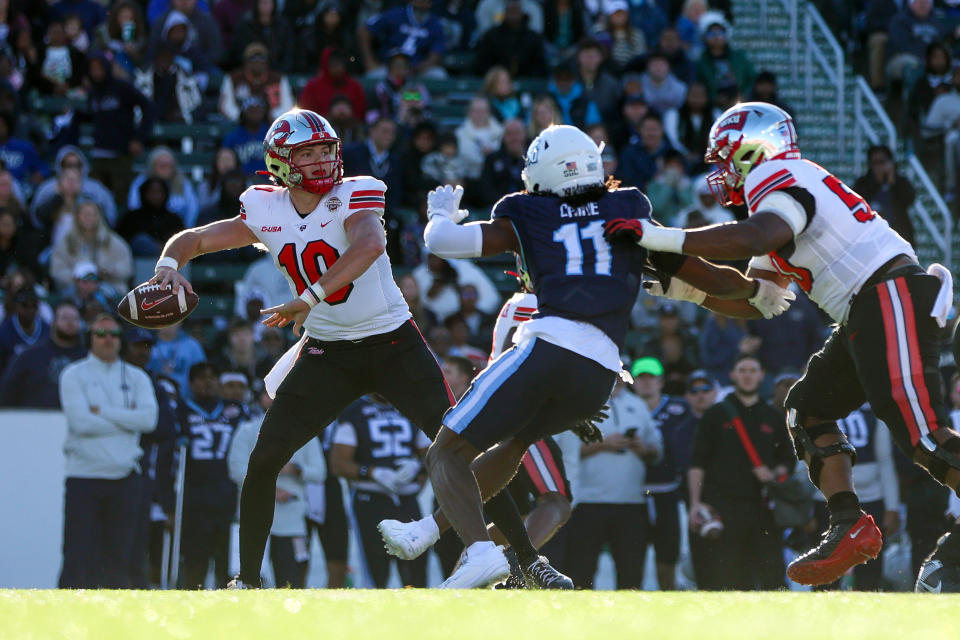 CHARLOTTE, NORTH CAROLINA - DECEMBER 18: Caden Veltkamp #10 of the Western Kentucky Hilltoppers throws the ball against the Old Dominion Monarchs during the first half of the Famous Toastery Bowl at Jerry Richardson Stadium on December 18, 2023 in Charlotte, North Carolina. (Photo by Isaiah Vazquez/Getty Images)