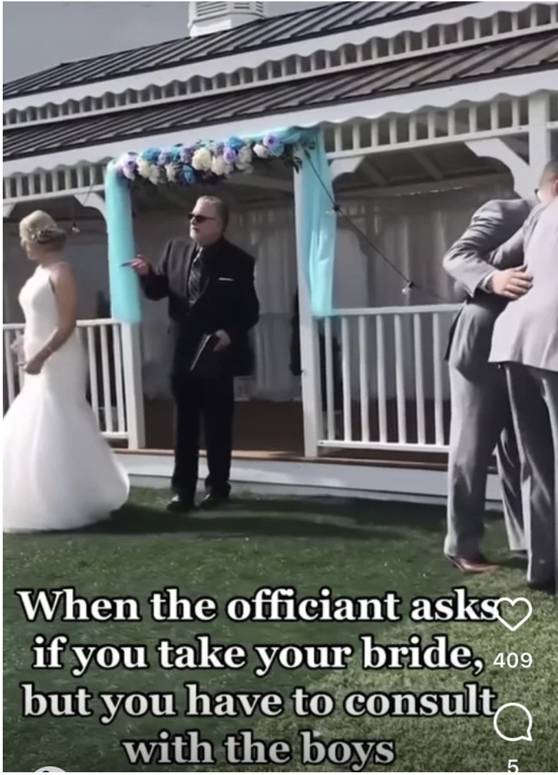 A groom consulting with his boys when the officiant asked if he took the bride to be his wife