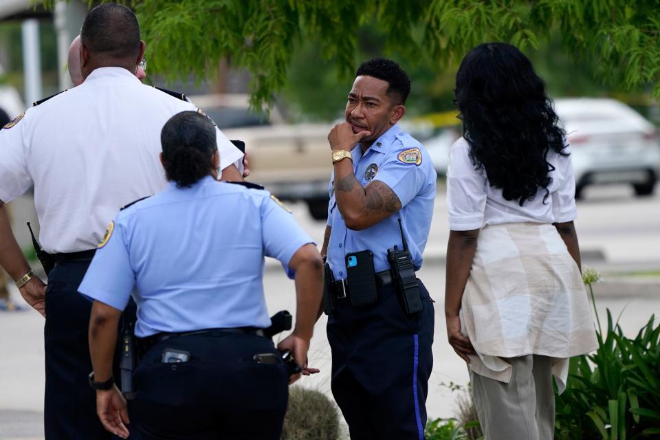 Investigators search the crime scene of a shooting at Xavier University in New Orleans.