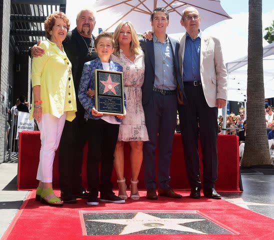 <p>FREDERIC J. BROWN/AFP via Getty</p> Guy Fieri with mom Penny, son Ryder, wife Lori, son Hunter and dad Jim