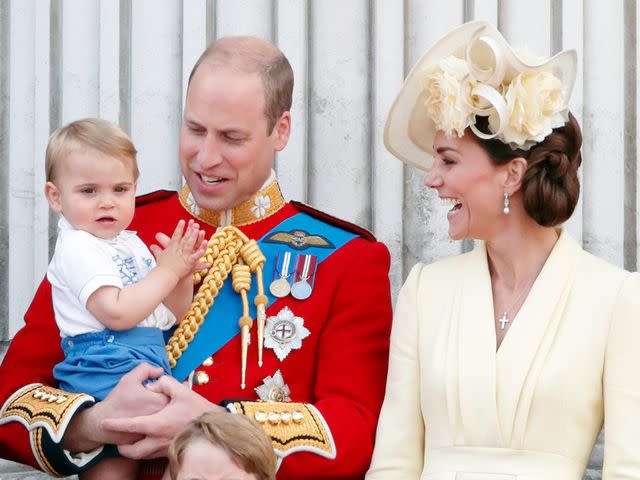 <p>Max Mumby/Indigo/Getty</p> Prince William holding Prince Louis next to Kate Middleton in 2019