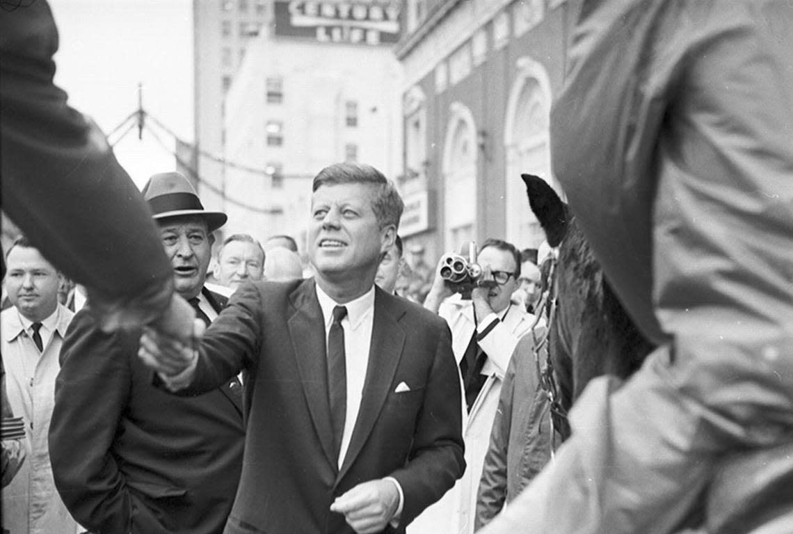 President John F. Kennedy greets mounted sheriff’s patrol and crowd control officers who are on horseback in front of Hotel Texas in downtown Fort Worth. The man in the hat is Sheriff Lon Evans. 11/22/1963