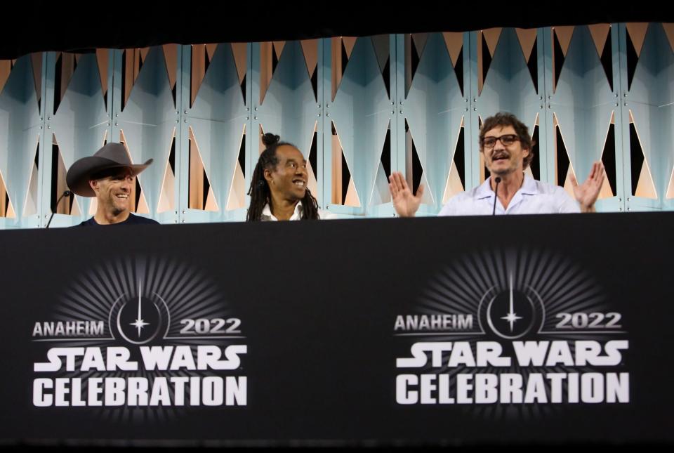 ANAHEIM, CALIFORNIA - MAY 28: (L-R) Brendan Wayne, Lateef Crowder, and Pedro Pascal attend the panel for “The Mandalorian” series at Star Wars Celebration in Anaheim, California on May 28, 2022. (Photo by Jesse Grant/Getty Images for Disney)