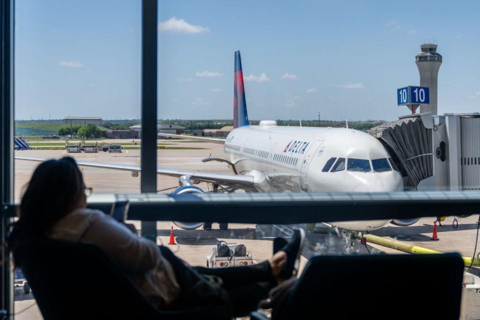 delta air lines terminal gate passenger waits