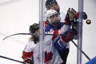 <p>Haley Irwin (21), of Canada, Megan Keller (5), of the United States, and Rebecca Johnston (6), of Canada, reach for the puck during the second period of the women’s gold medal hockey game at the 2018 Winter Olympics in Gangneung, South Korea, Thursday, Feb. 22, 2018. (AP Photo/Jae C. Hong) </p>