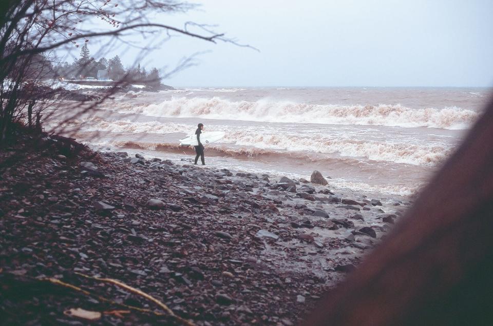 A shot of a surfer going into the waters of Lake Superior, shot for the documentary "Freshwater."