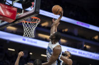 Orlando Magic center Mo Bamba (5) scores a basket as Sacramento Kings center Tristan Thompson, right, defends during the second half of an NBA basketball game in Sacramento, Calif., Wednesday, Dec. 8, 2021. (AP Photo/Jose Luis villegas)