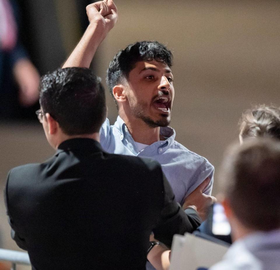 Security escort out a pro-Palestine protester who was shouting while Joe Biden spoke at a campaign event at the Jim Graham building at the North Carolina State Fairgrounds in Raleigh on Friday June 28, 2024.