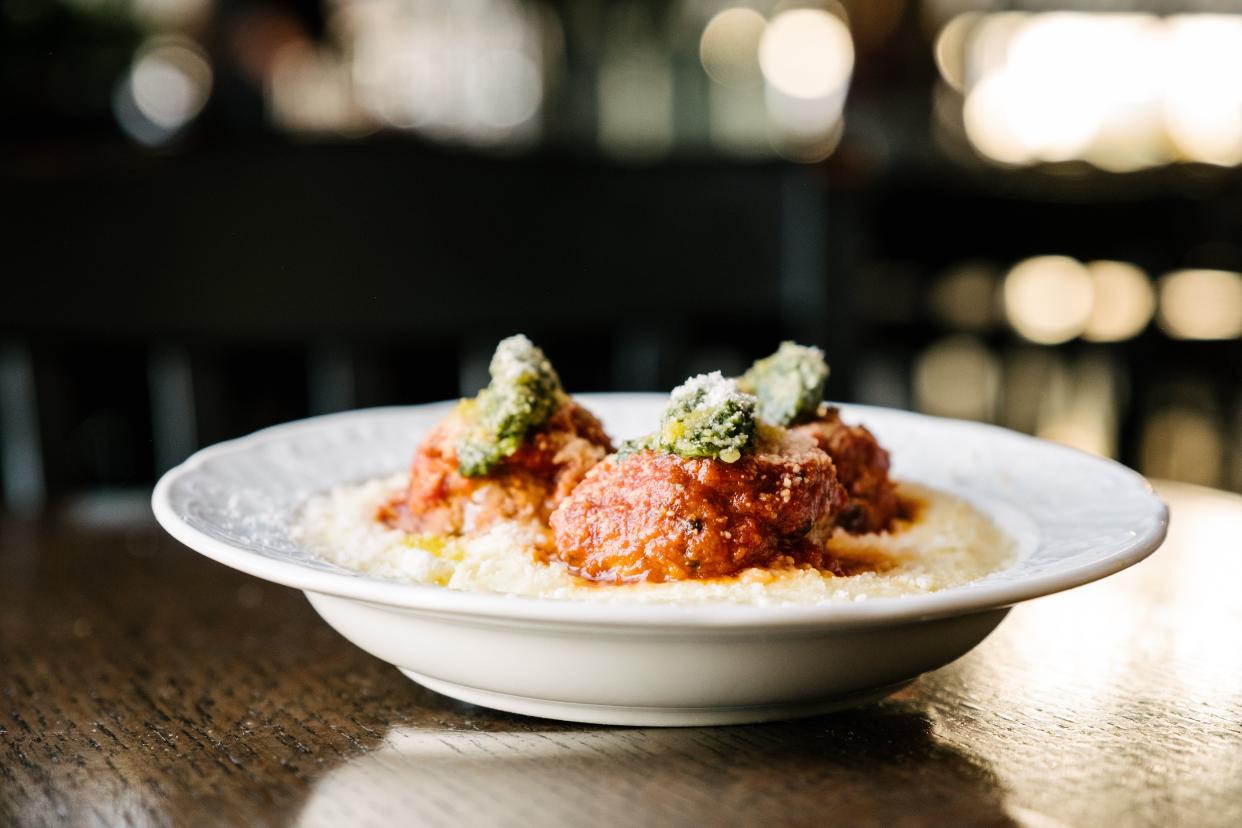 Meatballs over Parmesan polenta is a menu favorite at Grato restaurant in West Palm Beach. 