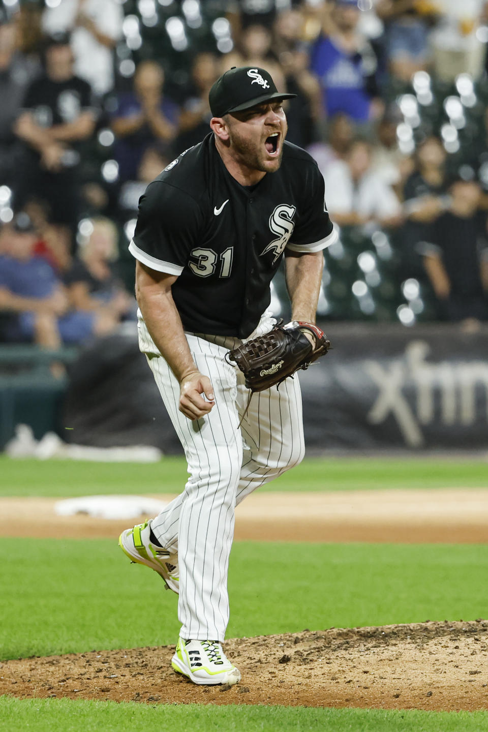 Chicago White Sox relief pitcher Liam Hendriks reacts after the final out in the team's win over the Kansas City Royals in a baseball game Wednesday, Aug. 31, 2022, in Chicago. (AP Photo/Kamil Krzaczynski)