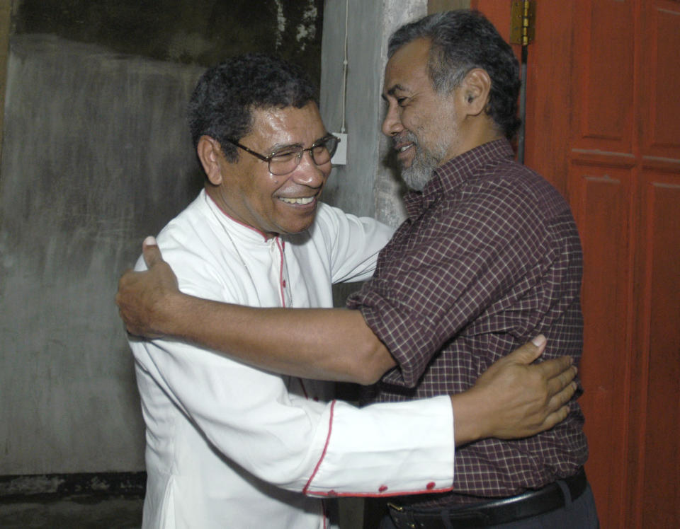 FILE - East Timor's President Xanana Gusmao, right, welcomes the country's influential Roman Catholic Bishop Carlos Ximenes Belo in Gusmao's palace in Dili, on Jan. 13, 2004. Belo has been accused in a Dutch magazine article of sexually abusing boys in East Timor in the 1990s, rocking the Catholic Church in the impoverished nation and forcing officials at the Vatican and his religious order to scramble to provide answers. (AP Photo/Firdia Lisnawati, File)