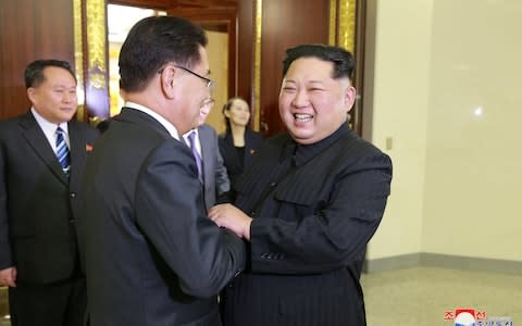 Kim Jong-un greets a member of the special delegation of South Korea's President - Credit: KCNA via Reuters