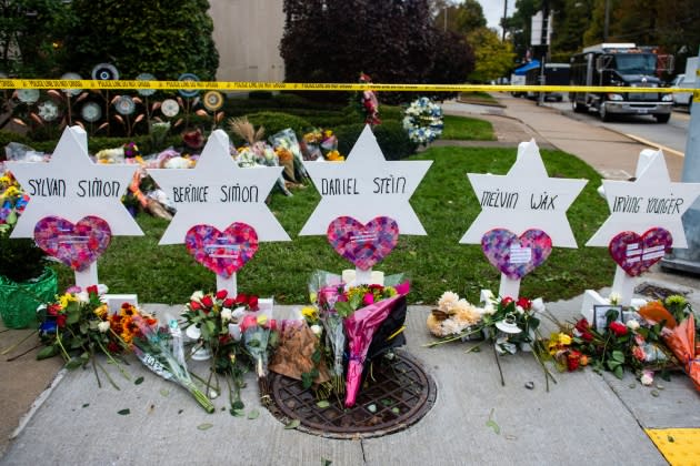 Flowers and stones are placed on the memorials erected - Credit: Matthew Hatcher/SOPA Images/LightRocket via Getty Images
