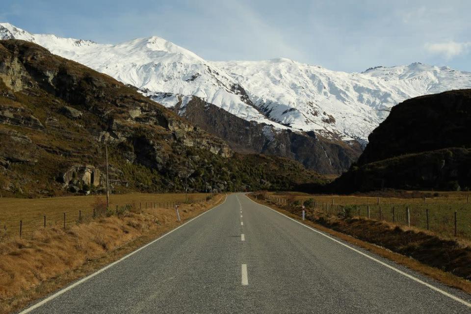 Mt. Aspiring road leading to Treble Cone ski resort in Wanaka, New Zealand.