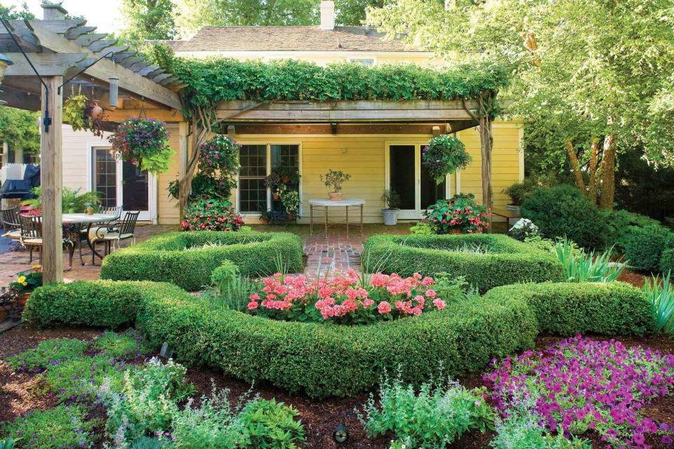 Outdoor rooms change over time. The homeowners built this arbor the first year they were in the home. When the wisteria covered the top, they realized it was a great room. The garden