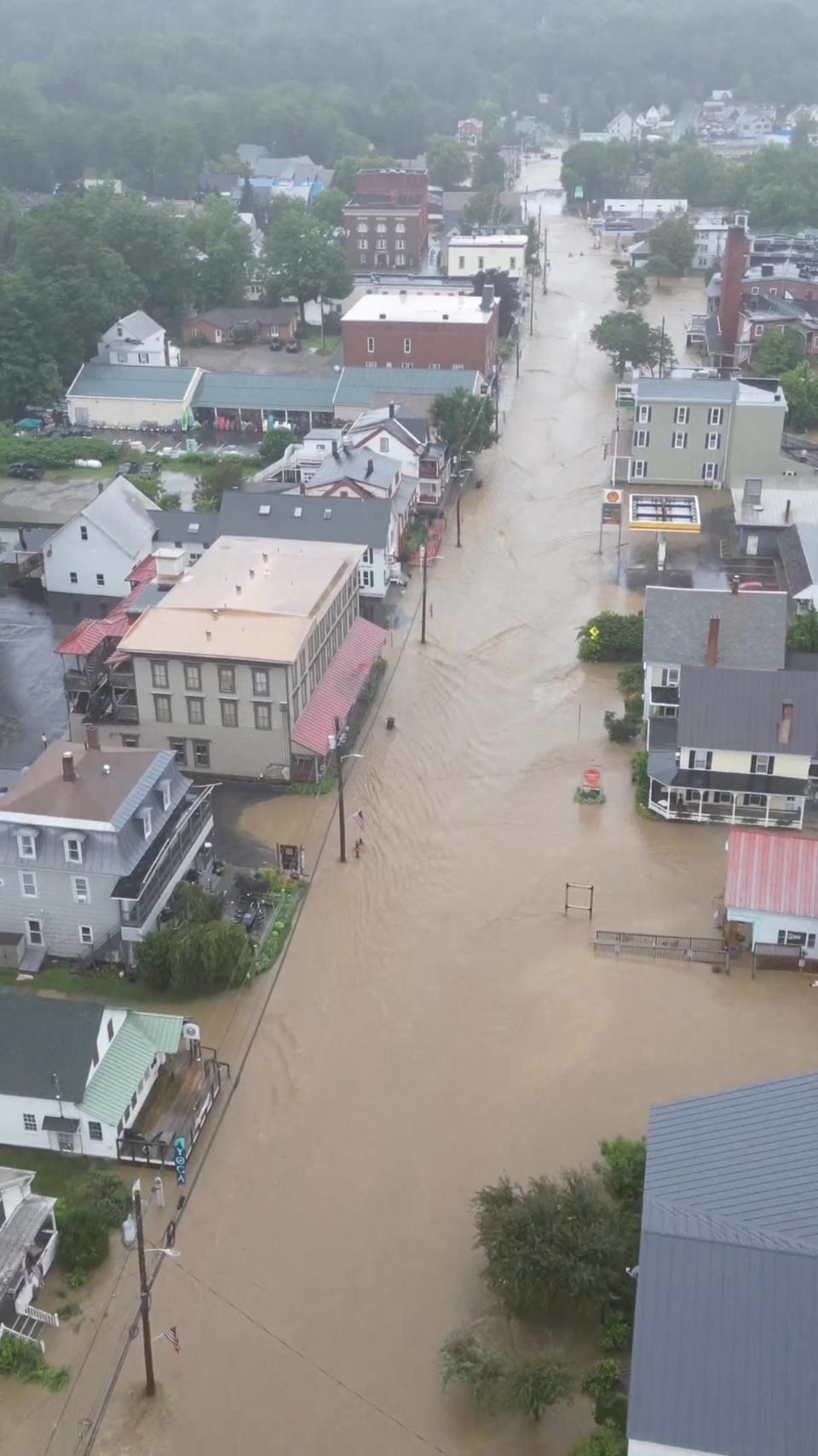 The downtown area of Ludlow, Vermont on Monday as floodwaters rushed through the streets (via REUTERS)