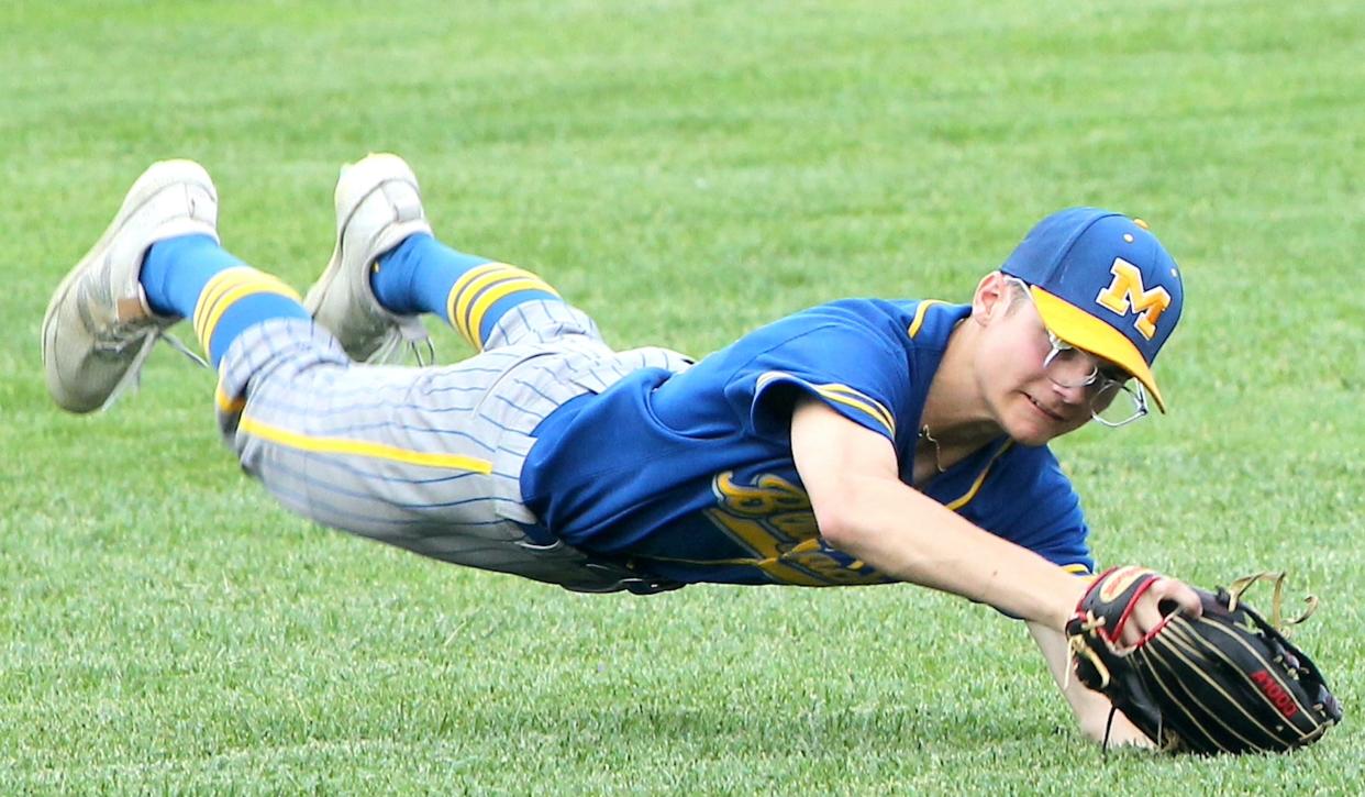 Mitchell's Ashton Luman (16) makes a leaping catch in right field on Friday, May 3, 2024.