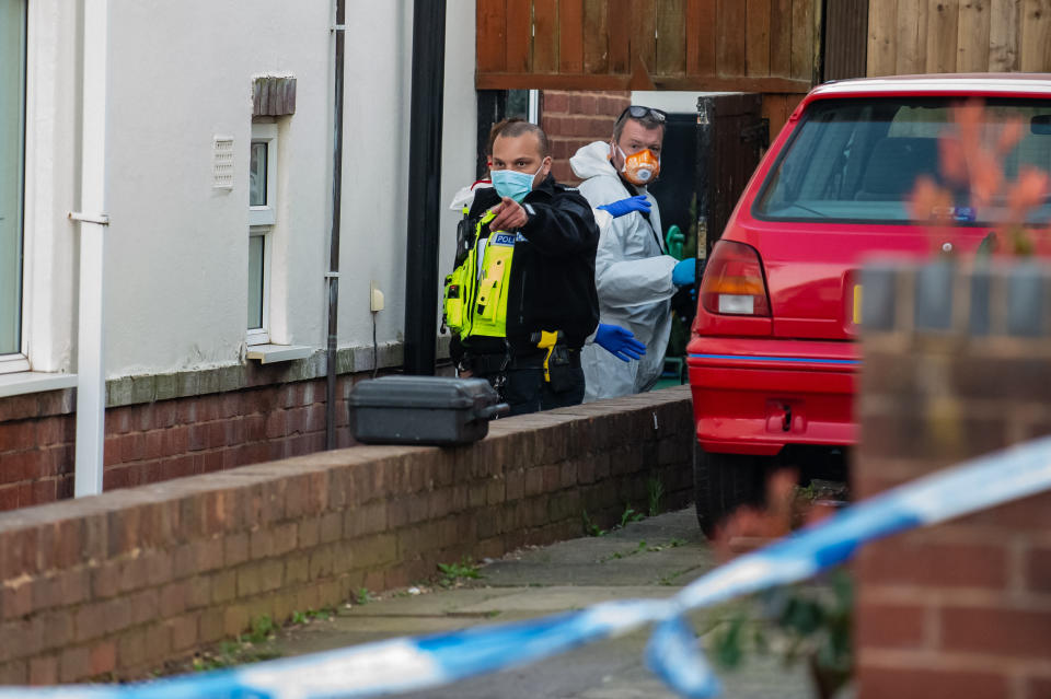 Police at the scene on Bounry Avenue, Rowely Regis, West Midlands. (SWNS)