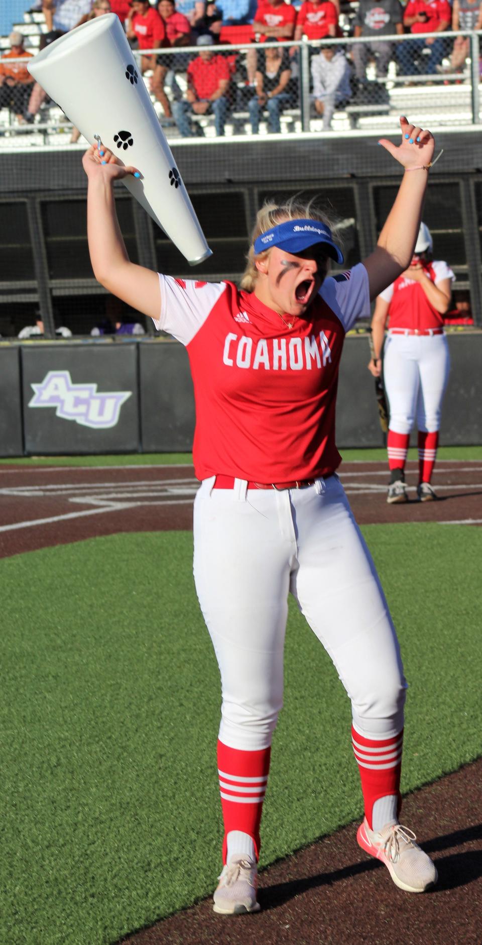 Coahoma's Lexi King led her team and fans in cheers before and between innings Thursday against Holliday.