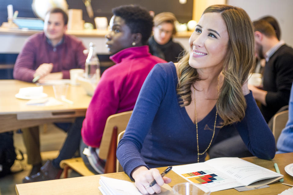 BROOKLINE, MA - JANUARY 8: At right, Lauren Bell, a Boston resident and creative director at an advertising agency, attend Steven Taylor's The Basics of Investing: Level I class at Society of Grownups headquarters on January 8, 2016 in Brookline, Massachusetts. The Society of Grownups is both a cafe and a financial wellness center that offers workshops and individual checkups to help Millennials manage their finances. (Photo by Ann Hermes/The Christian Science Monitor via Getty Images)