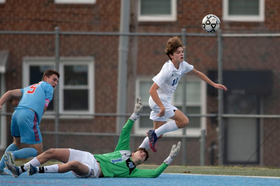 CEC sophomore Dylan Kopenits jumps over Father Judge goalie Jim Shelton to shoot at James Ramp Memorial Recreation Center in Philadelphia on Wednesday, Oct. 26, 2022. Conwell-Egan Catholic fell to Father Judge 2-0 in PCL semifinals.