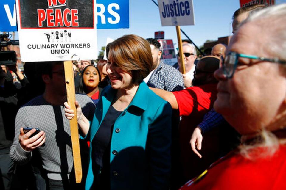 Democratic presidential candidate Sen. Amy Klobuchar, D-Minn., walks on a picket line with members of the Culinary Workers Union Local 226 outside the Palms Casino in Las Vegas, Wednesday, Feb. 19, 2020.