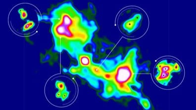  False-color image of the massive star formation region G333.23–0.06 from data obtained with the ALMA radio observatory. The insets show regions in which Li et al. were able to detect multiple systems of protostars. The star symbols indicate the location of each newly forming stars. The image covers a region 0.62 by 0.78 light-years in size (which on the sky covers a mere 7.5 times 9.5 arc seconds). 