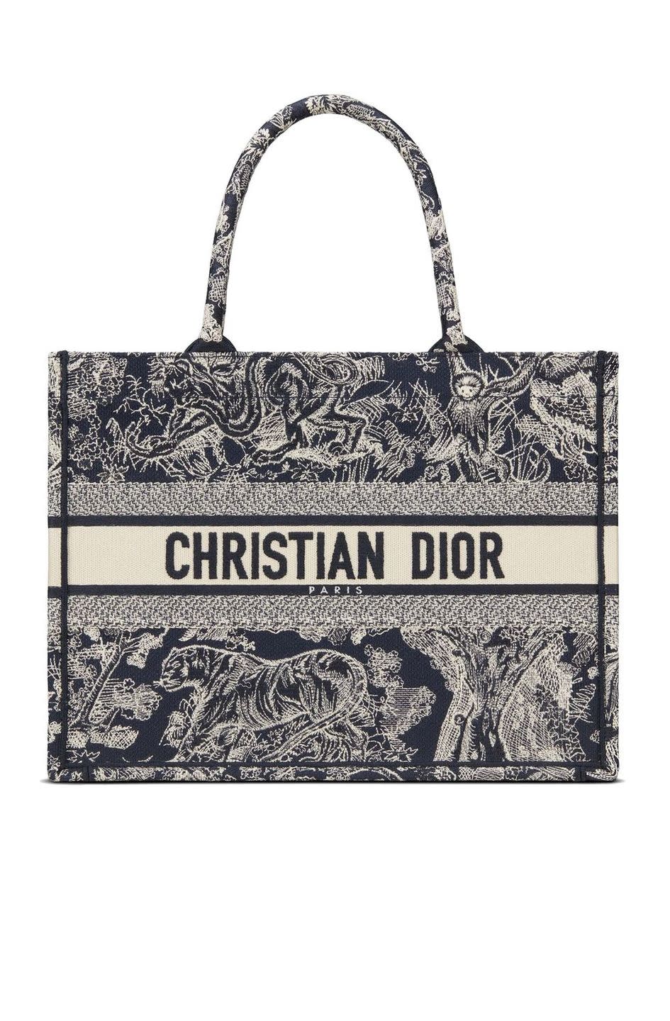 <p><a class="link " href="https://www.dior.com/en_gb/products/couture-M1296ZRGO_M928-small-dior-book-tote-blue-toile-de-jouy-reverse-embroidery" rel="nofollow noopener" target="_blank" data-ylk="slk:SHOP NOW;elm:context_link;itc:0;sec:content-canvas">SHOP NOW</a></p><p>It's not difficult to see why Dior's Book Tote remains so popular – the style, which has fast become a staple of the house, is the perfect way to elevate any daytime ensemble.</p><p>Embroidered bag, £2,300, <a href="https://www.dior.com/en_gb/products/couture-M1296ZRGO_M928-small-dior-book-tote-blue-toile-de-jouy-reverse-embroidery" rel="nofollow noopener" target="_blank" data-ylk="slk:Dior;elm:context_link;itc:0;sec:content-canvas" class="link ">Dior</a></p>