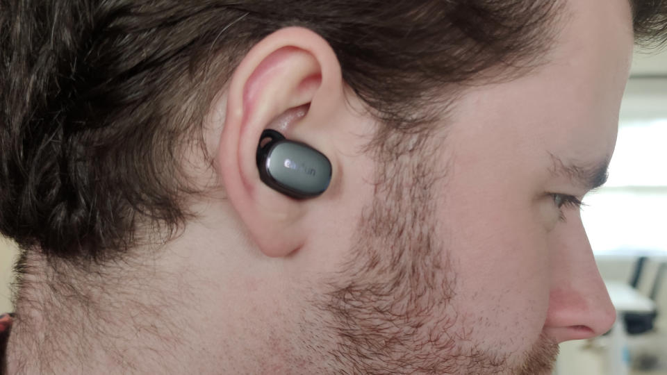 The Earfun Free Pro 3 in a man's ear.