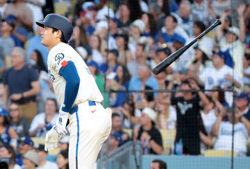 LOS ANGELES, CALIFORNIA – Shohei Ohtani of the Dodgers hits a two-run home run against the Angels.