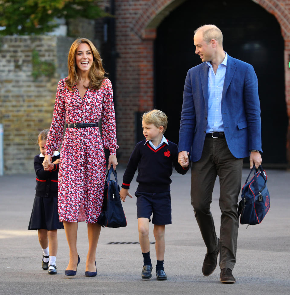 LONDON, UNITED KINGDOM - SEPTEMBER 5: Princess Charlotte, hide behind her mother the Duchess of Cambridge as she arrives for her first day at school, with her brother Prince George and her father the Duke of Cambridge at Thomas's Battersea in London on September 5, 2019 in London, England. (Photo by Aaron Chown - WPA Pool/Getty Images)