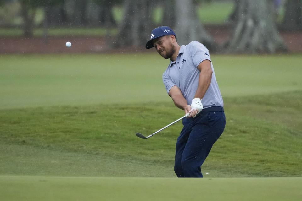 Xander Schauffele chips onto the seventh green during the second round of the PGA Zurich Classic golf tournament at TPC Louisiana in Avondale, La., Friday, April 21, 2023. (AP Photo/Gerald Herbert)