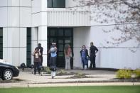 Friends and employees gather outside of Paisley Park, U.S. music superstar Prince's estate in Chanhassen, Minnesota April 21, 2016. Prince, the innovative U.S. music superstar whose songwriting and eccentric stage presence electrified fans around the world with hits including "Purple Rain" and "When Doves Cry," died on Thursday in Minnesota. He was 57. REUTERS/Craig Lassig