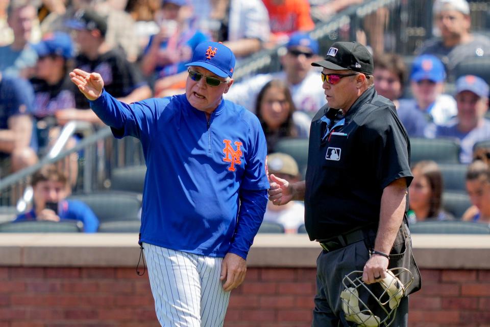 New York Mets manager Buck Showalter, left, argues with umpire Marvin Hudson, right, in the first inning of a baseball game against the Colorado Rockies, Sunday, May 7, 2023, in New York.