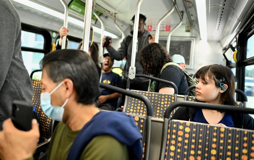 Torrance, California July 19, 2023-Tamara Cedillo rides the bus after her first job in Torrance. It takes Cedillo two hours and two buses to travel from her home in Carson to her job in Torrance. (Wally Skalij/Los Angles Times)