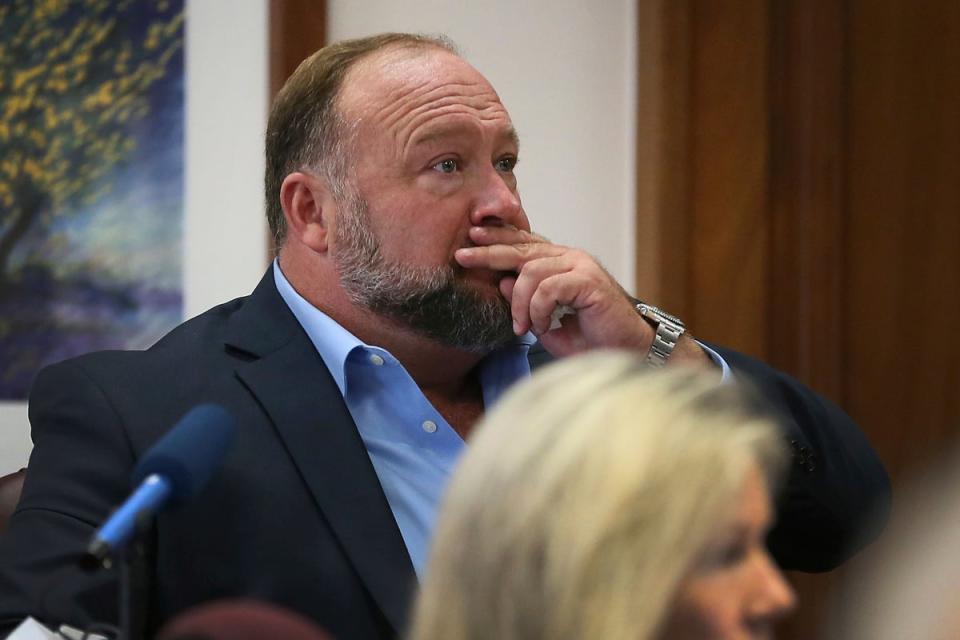 Alex Jones under questioning at his defamation trial atTravis County Courthouse in Austin on 3 August (AP)