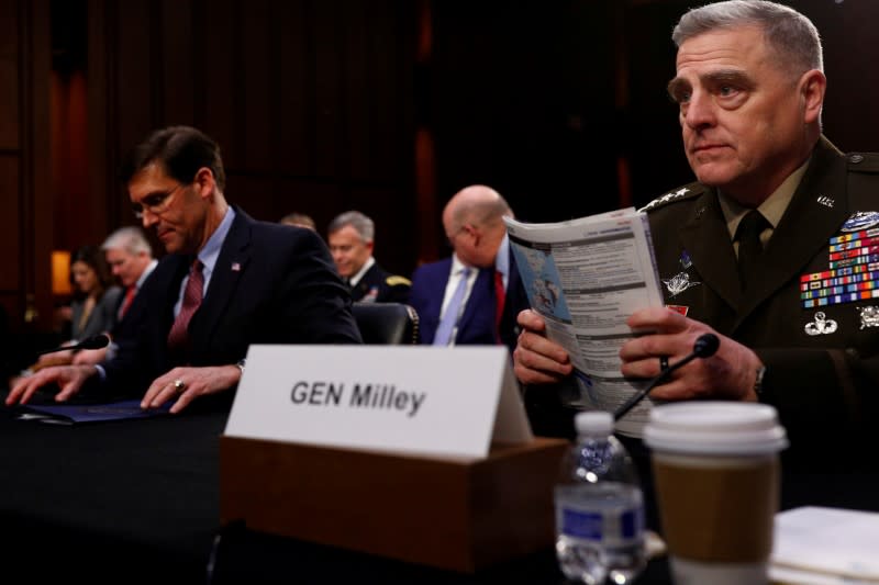 FILE PHOTO: U.S. Defense Secretary Mark Esper testifies beside U.S. Chairman of the Joint Chiefs of Staff Gen. Mark A. Milley before a Senate Armed Services Committee hearing on "Department of Defense Budget Posture" on Capitol Hill in Washington