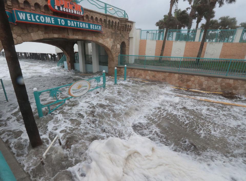 Waves wash up the Main Street beach ramp at high tide on Wednesday Tropical Storm Nicole moves closer to Volusia and Flagler counties.