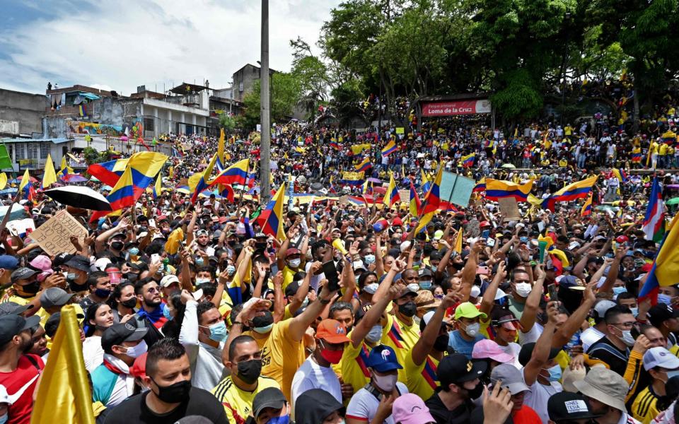 People protest against a tax reform bill they say will leave them poorer as the country battles its deadliest phase yet of the coronavirus pandemic - LUIS ROBAYO/AFP