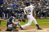 Milwaukee Brewers' Lorenzo Cain hits a home run during the third inning of a baseball game against the San Diego Padres Tuesday, Sept. 17, 2019, in Milwaukee. (AP Photo/Morry Gash)