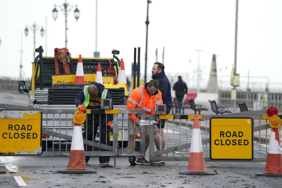 Workers close the Clarence Esplanade as Storm Ciaran brings high winds and heavy rain along the south coast of England, in Southsea, Portsmouth, Thursday, Nov. 2, 2023. Winds up to 180 kilometers per hour (108 mph) slammed France's Atlantic coast overnight as Storm Ciaran lashed countries around western Europe, uprooting trees, blowing out windows and leaving 1.2 million French households without electricity Thursday. Strong winds and rain also battered southern England and the Channel Islands, where gusts of more than 160 kph (100 mph) were reported. (Andrew Matthews/PA via AP)