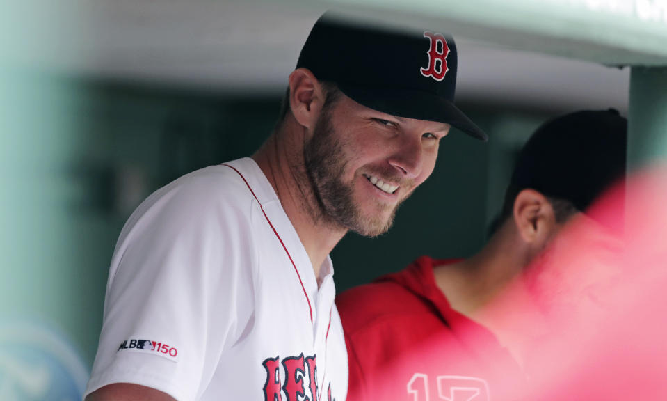 Boston Red Sox starting pitcher Chris Sale smiles in the dugout after completing his outing during the sixth inning of a baseball game against the Toronto Blue Jays at Fenway Park in Boston, Thursday, July 18, 2019. Sale allowed no runs in six innings. (AP Photo/Charles Krupa)