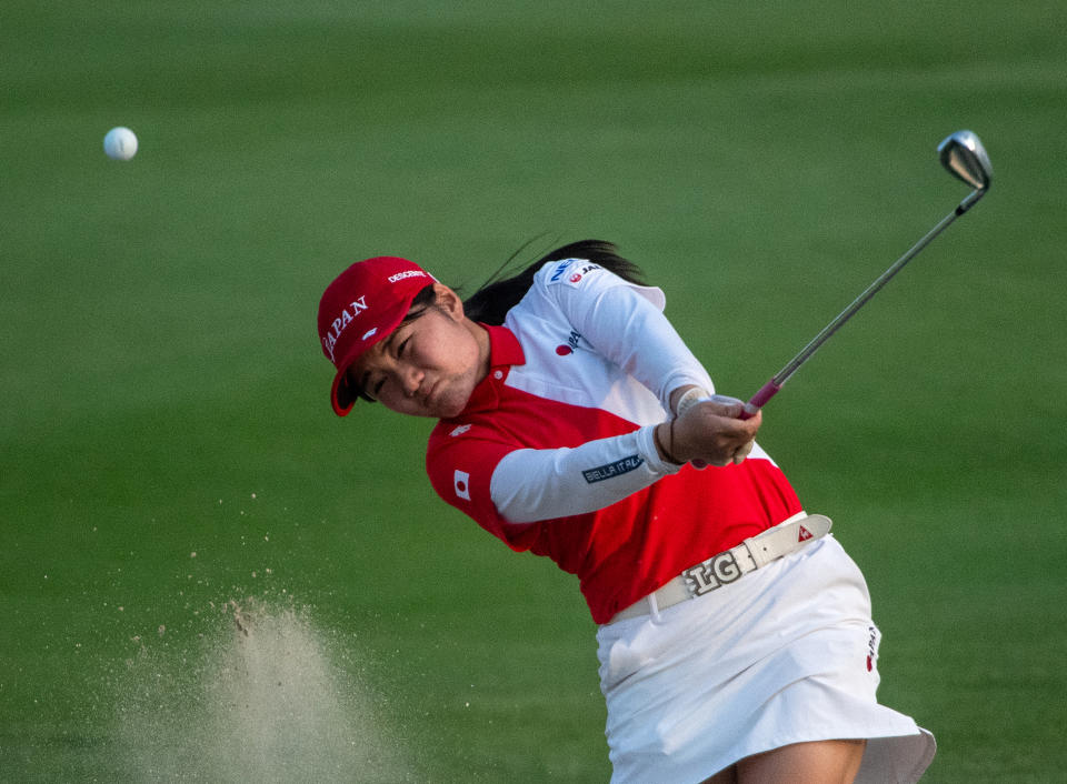 Mamika Shinchi of Japan strikes the ball from a bunker to the eighth green during the 2023 World Amateur Team Championships – Espirito Santo Trophy at Abu Dhabi Golf Club on October 25, 2023 in Abu Dhabi, United Arab Emirates. (Photo by Martin Dokoupil/Getty Images)