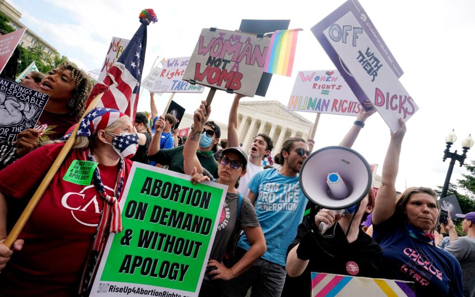 People protest about abortion outside the Supreme Court in Washington - Steve Helber /AP