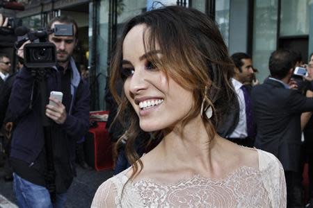 Actress Berenice Marlohe reacts during a ceremony honoring actor Javier Bardem with a star on the Hollywood Walk of Fame in Hollywood, California, November 8, 2012. REUTERS/Jonathan Alcorn