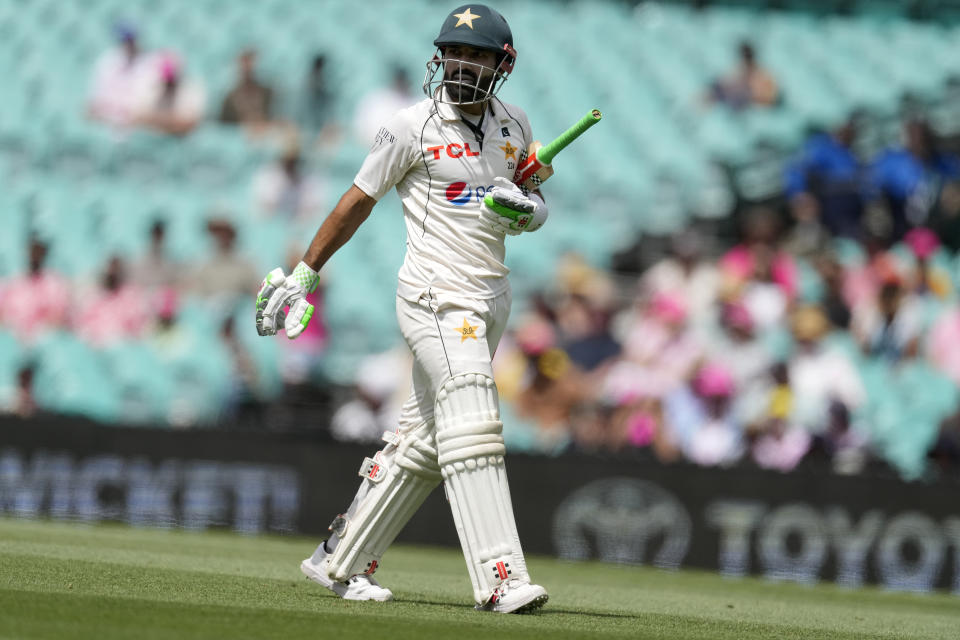 Pakistan's Mohammad Rizwan walks off after he is caught out by Australia on the fourth day of their cricket test match in Sydney, Saturday, Jan. 6, 2024. (AP Photo/Rick Rycroft)