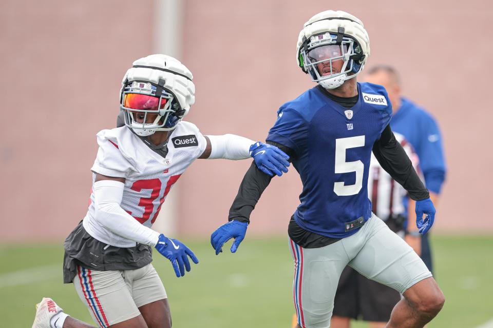 Jul 24, 2024; East Rutherford, NJ, USA; New York Giants wide receiver Allen Robinson II (5) is defended by New York Giants cornerback Kaleb Hayes (38) during training camp at Quest Diagnostics Training Facility. Mandatory Credit: Vincent Carchietta-USA TODAY Sports